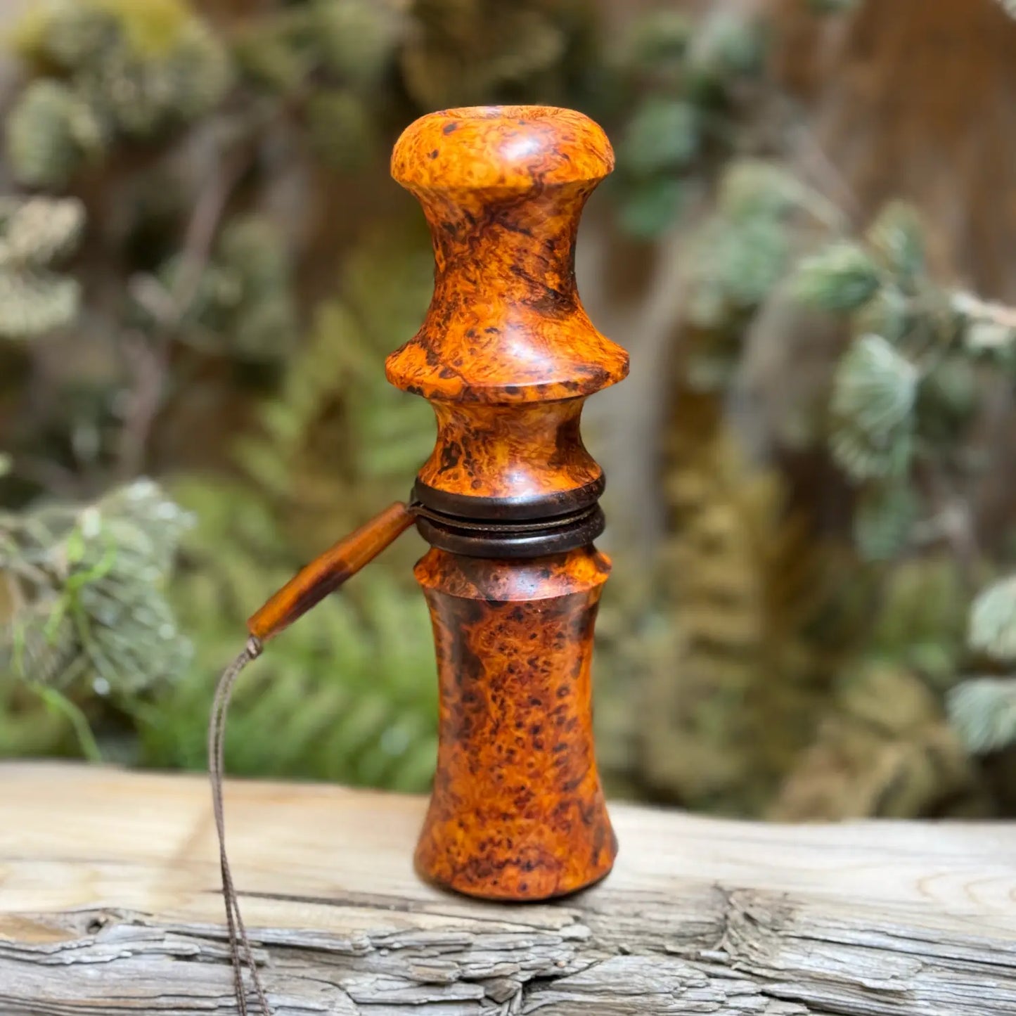 Handcrafted golden orange and bronze glowing amboyna burl owl hooter in a compact design with custom lanyard perfect for locating turkeys