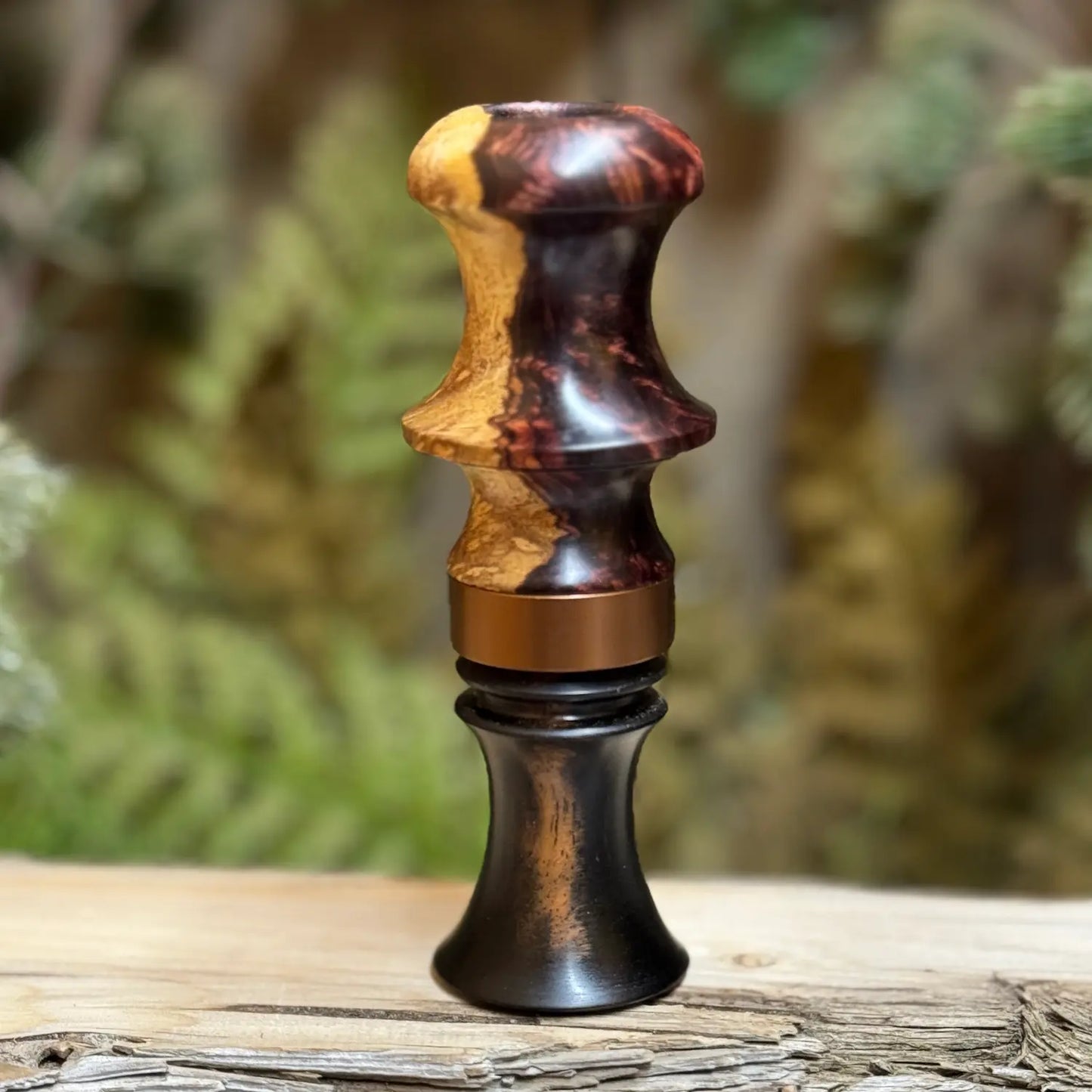 Honduran Rosewood Burl call for wood ducks features a Gabon ebony insert with a delrin sleeve, accented with a burnt bronze band.