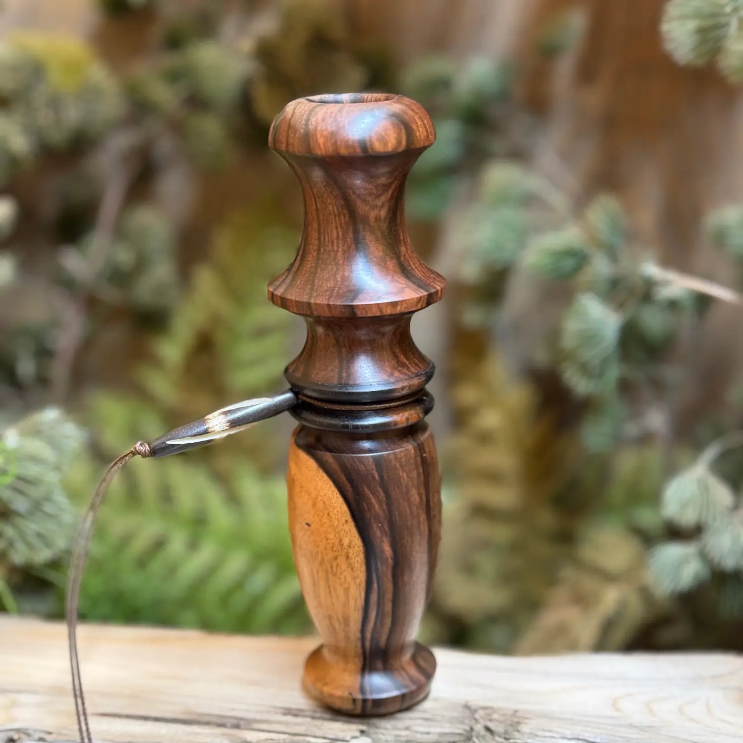 Lighter tone Mun ebony doe grunt-bleat with sappy inclusion. A custom lanyard groove is featured with Gabon ebony details.