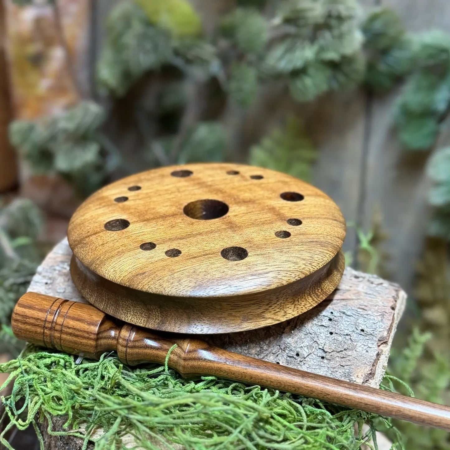 Shedua wood turkey pot call with contoured edge for better grip and wood with a lighter sheen when lain flat atop a Bolivian Rosewood striker.