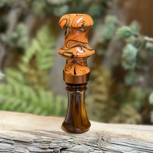 Acrylic "Cocobolo Burl" Double Dagger Duck Call with orange and black swirling designs and copper band