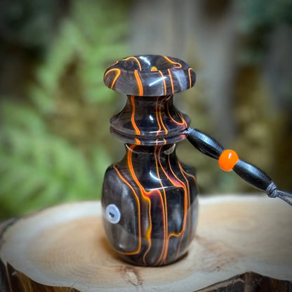 Lava orange and smokey silver swirls in obsidian black acrylic hand crafted on the lathe into a rabbit distress squealer with custom matching lanyard. Radiant orange highlights.