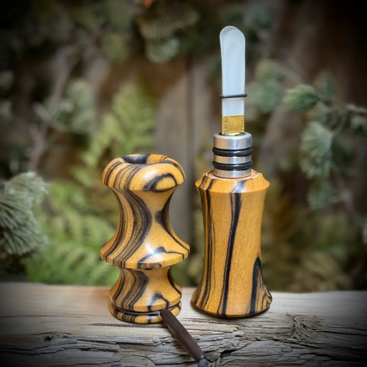 Custom crafted black and white ebony wood owl hooter sitting open in two parts showing reed insert and from mouthpiece. 