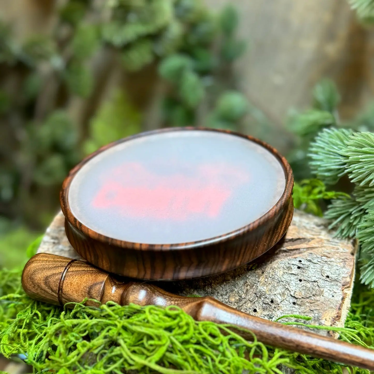 Bolivian Rosewood Turkey Call with frosted glass and Wild Country Customs logo in red upright with matching striker in foreground