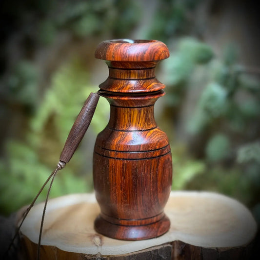 deep red and golden wood grains glow in this perfectly rounded grunt tube with compact design and wide chamber. The black detailed grooves and lanyard channel make this a comfortable fit in your hand when using the whitetail snort wheeze custom game call.