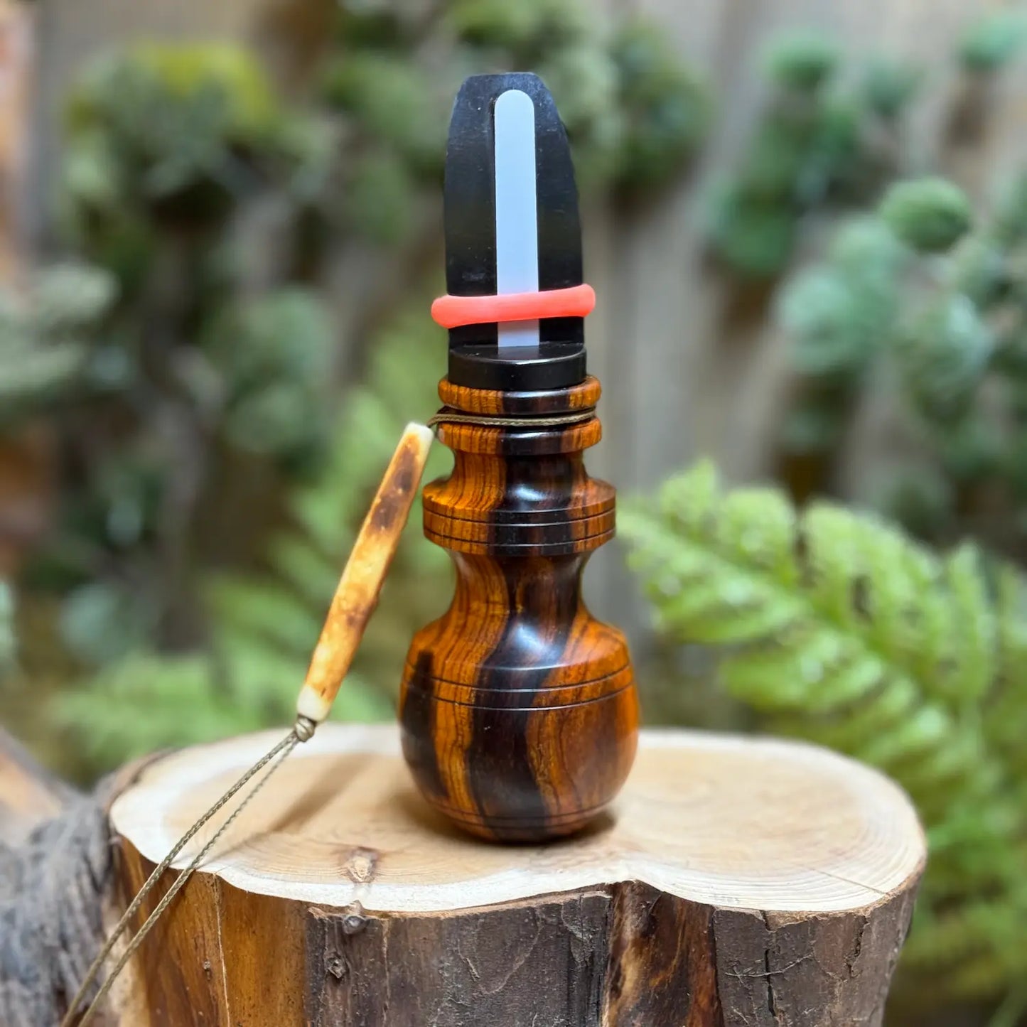 Desert Ironwood Cow Elk Call with beautiful black, brown, and copper figuring in the wood grain