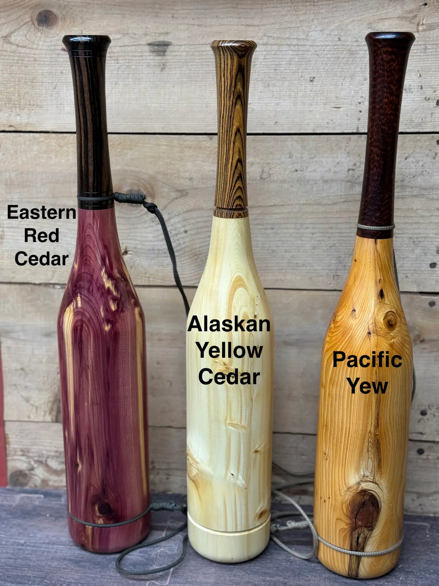 Three Elk Bugles side by side showing Eastern Red Cedar next to Alaskan Yellow Cedar and Pacific Yew woods.
