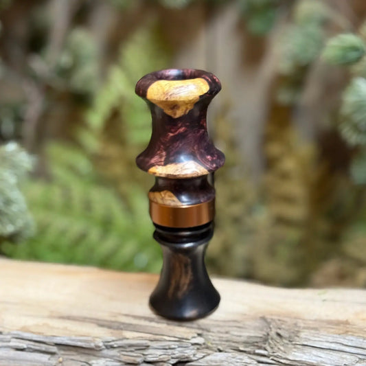 Honduran Rosewood Burl call for wood ducks features a Gabon ebony insert with a delrin sleeve, accented with a burnt bronze band.