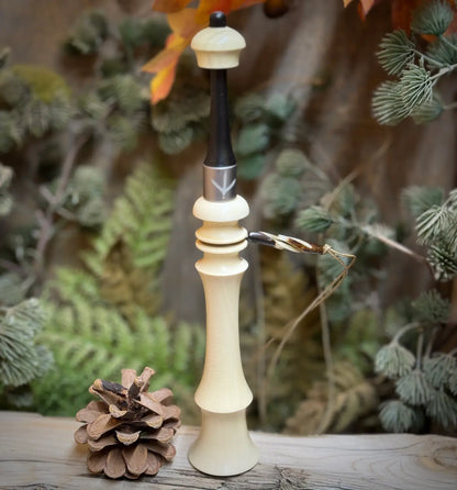 Turkey Trumpet in light wood tone showing blonde wood color and custom silver or nickel colored band with the imprint of a turkey foot.