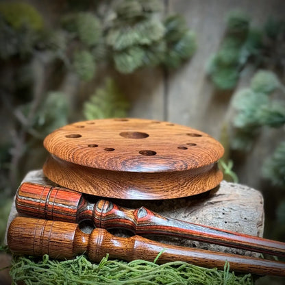 Honduran Rosewood Turkey Call seated next to a matching striker and a Dymalux laminate striker