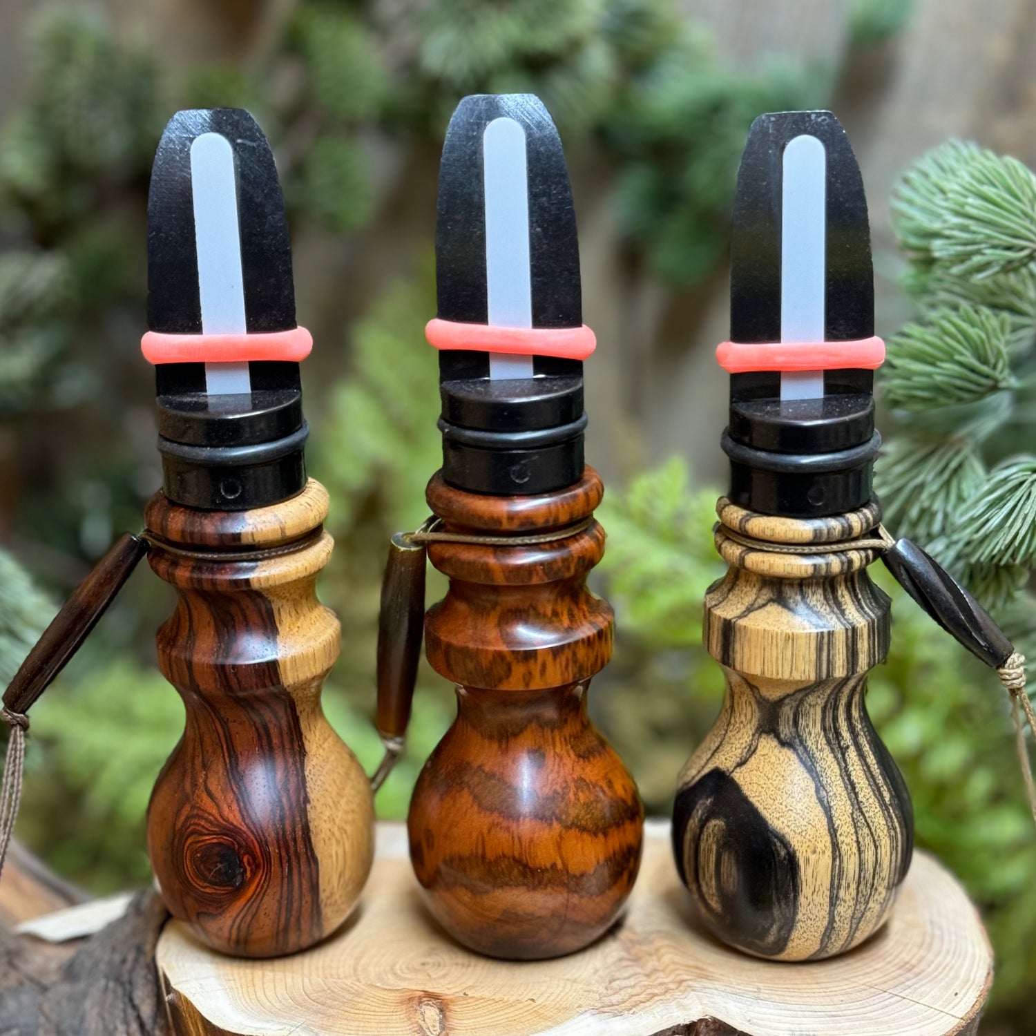 Three custom elk calls in sappy cocobolo, snakewood, and black & white ebony