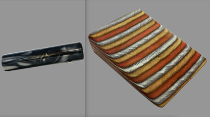 swatch of swirling black and silver tone acrylic rod next to Jacaranda laminate wood pattern of alternating grey, copper, and bronze tones