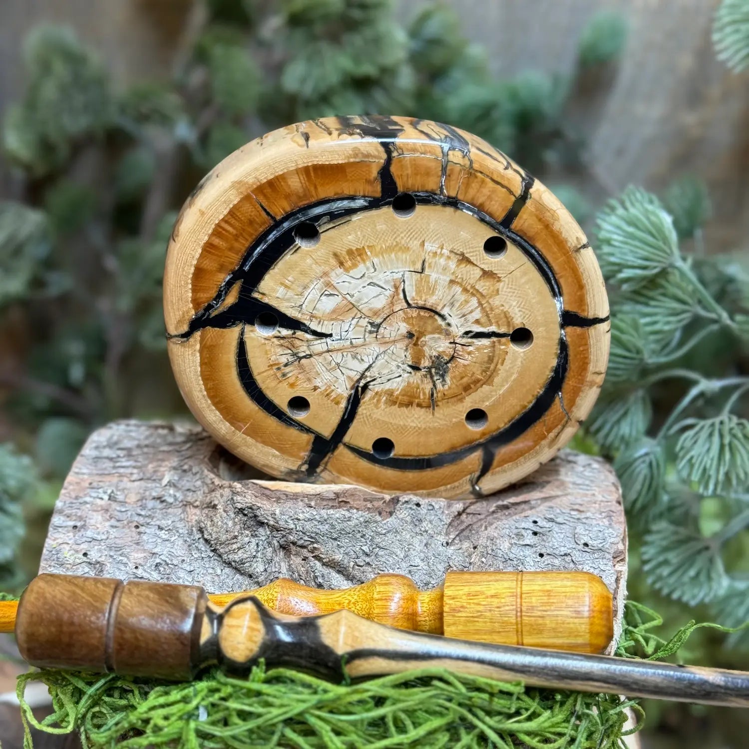 Rare Mammoth Tusk Turkey Call with two premium strikers laying crisscross in foreground
