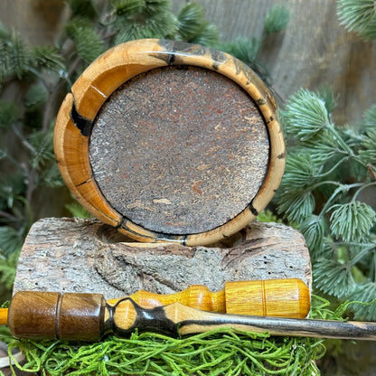 Rare Mammoth Tusk Turkey Call with Dinosaur bone surface and two premium strikers laying crisscross in foreground