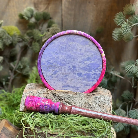Maple Burl Hybrid Turkey Call with Purple and Pink died resin and purple jade slate surface propped up behind a matching maple burl hybrid striker with detailed inlays and purpleheart stem