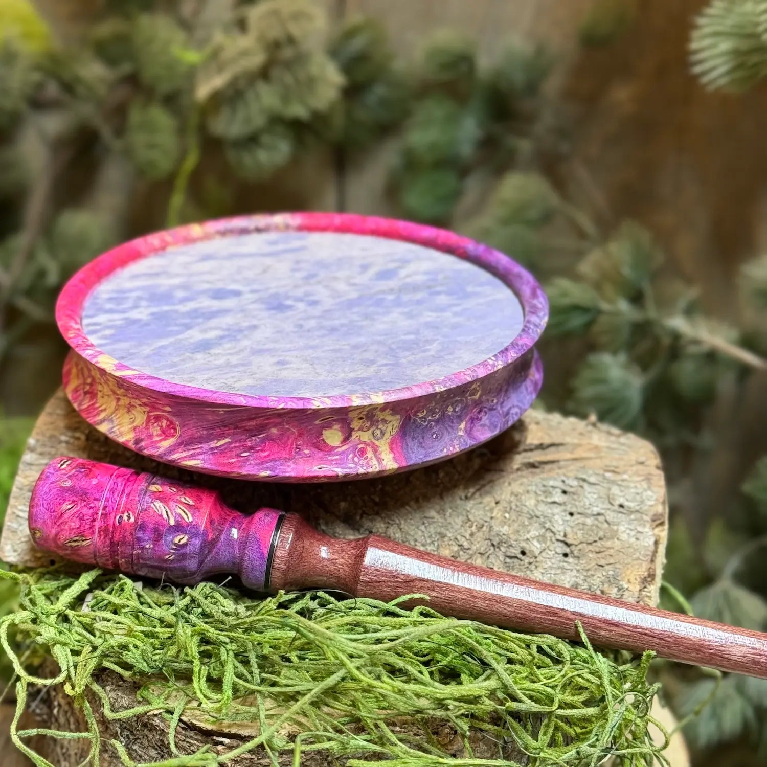 Maple Burl Hybrid Turkey Call with Purple and Pink died resin and purple jade slate surface propped up behind a matching maple burl hybrid striker with detailed inlays and purpleheart stem
