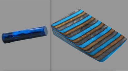 swatch of swirling black and electric blue tone acrylic rod next to Safari laminate wood pattern of alternating grey, lapiz blue, bronze or copper tones with black division lines