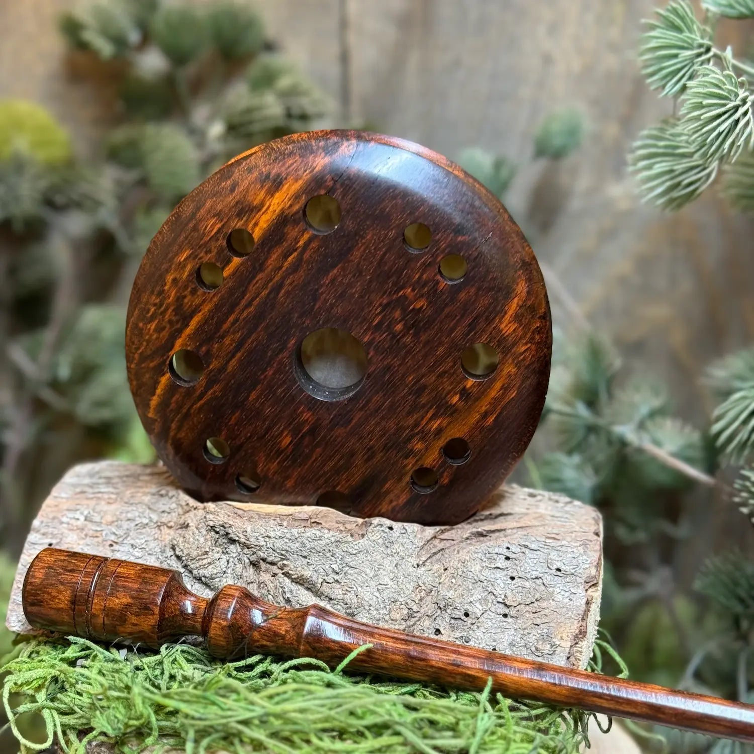 Snakewood pot call featuring gorgeous rich tones of this exotic hardwood set next to matching snakewood striker.