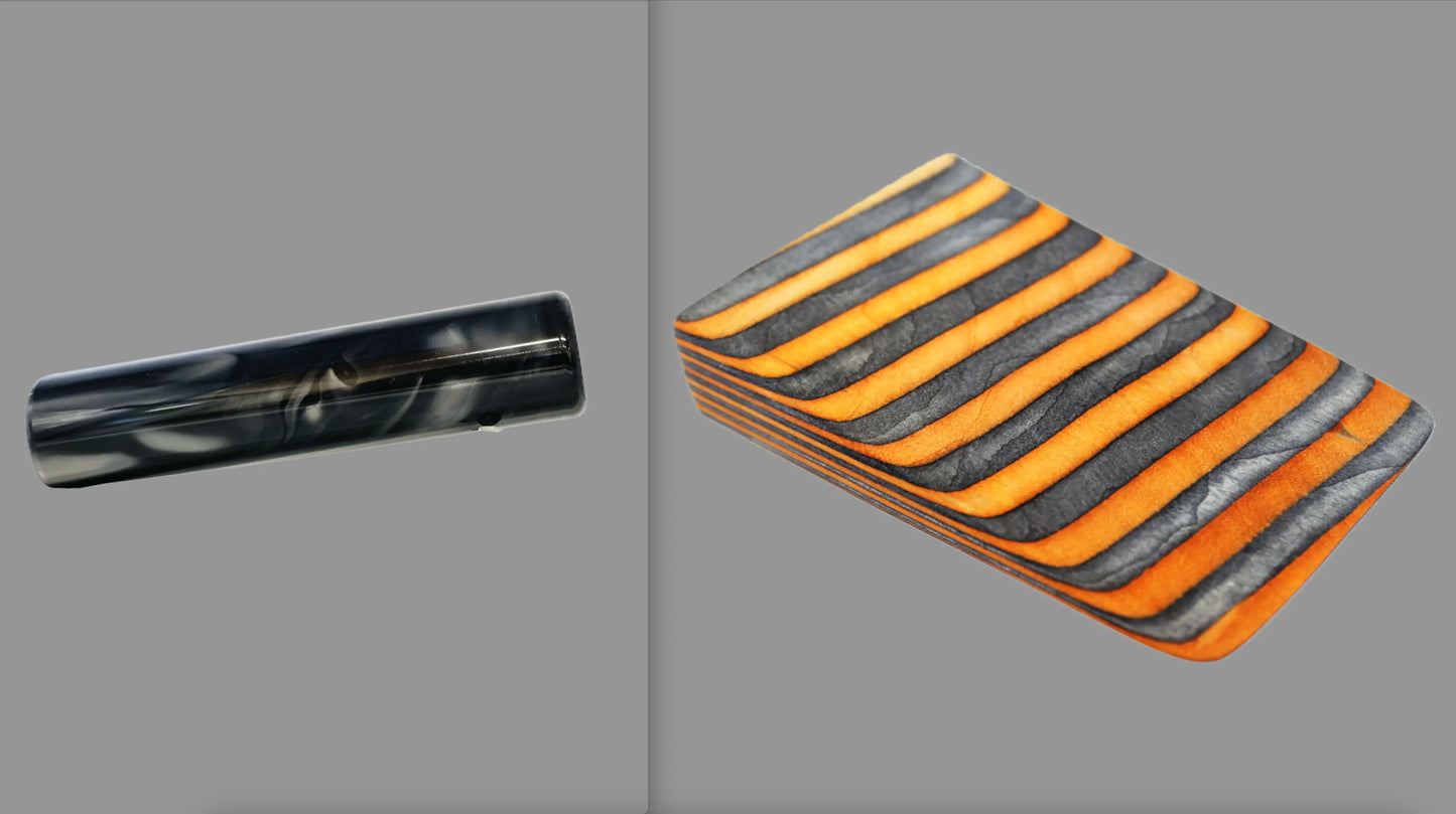 swatch of swirling black and grey tone acrylic rod next to Wildfire laminate wood pattern of alternating ash silver and neon orange tones set off by black dividing lines
