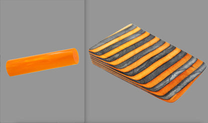 swatch of swirling neon orange tone acrylic rod next to Wildfire laminate wood pattern of alternating ash silver and neon orange tones set off by black dividing lines